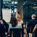 woman-presenting-to-audience-at-work