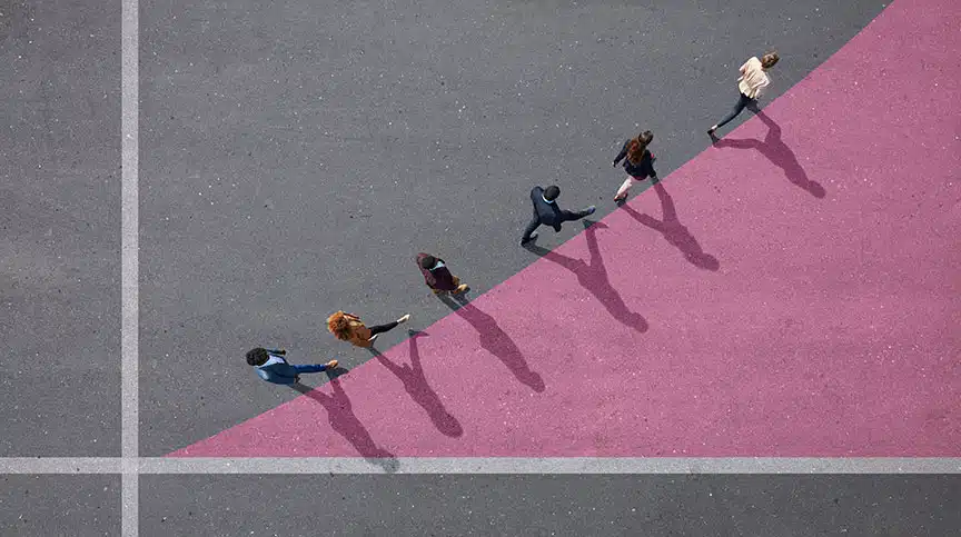 image of employees walking on bar graph representing the concept of scaling development opportunities for employees