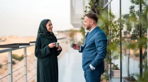 A man and woman in the Middle East discuss resilience challenges.